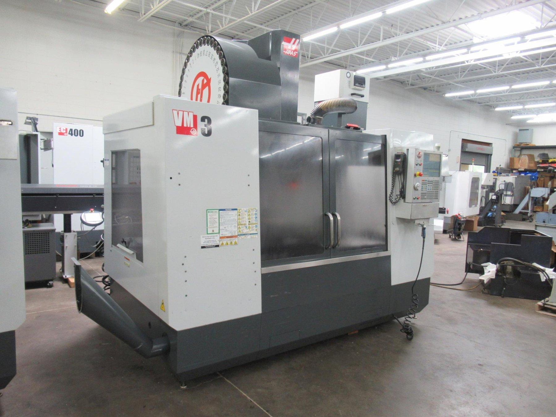 Haas VM-3 CNC Vertical Machining Center with 12,000 RPM CT-40 Spindle, 40 Station Side Mount Tool Changer, Probing, 1000 PSI TSC, High Speed Machining, Mist Collector,  Chip Auger.