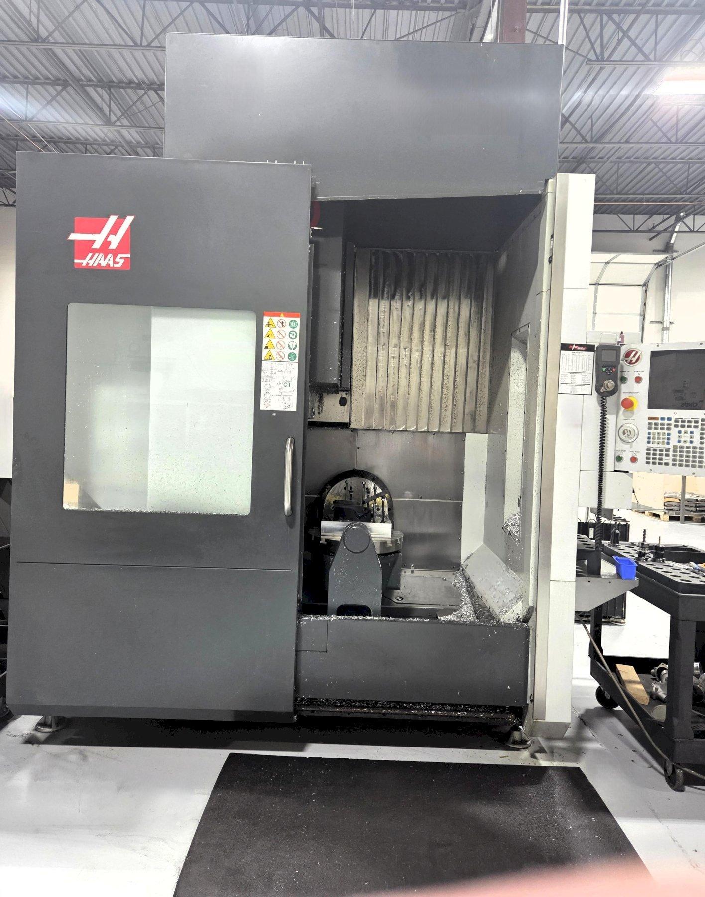 Haas UMC-750 5-Axis 2018 with: 5th Axis, 10k RPM Spindle, Through Spindle Coolant, 30-SMTC, HSM, Probing, Chip Conveyor, and Coolant Tank.
