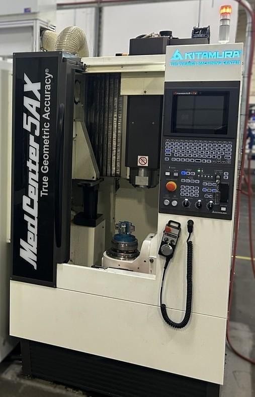 Kitamura Medcenter5AX Vertical Machining Center w/ Arumatik Mi Control, 300-30,000 RPM Direct Drive Spindle, Spindle Oil Cooler, Renshaw NC4+ Blue F115C Probe, High Capacity 40 Tool ATC w/ 120 ATC Upgrade, Raptor SP1882 Tombstone w/ (4) Raptor Vices RWP019SS, Scraper Type Chip Conveyor