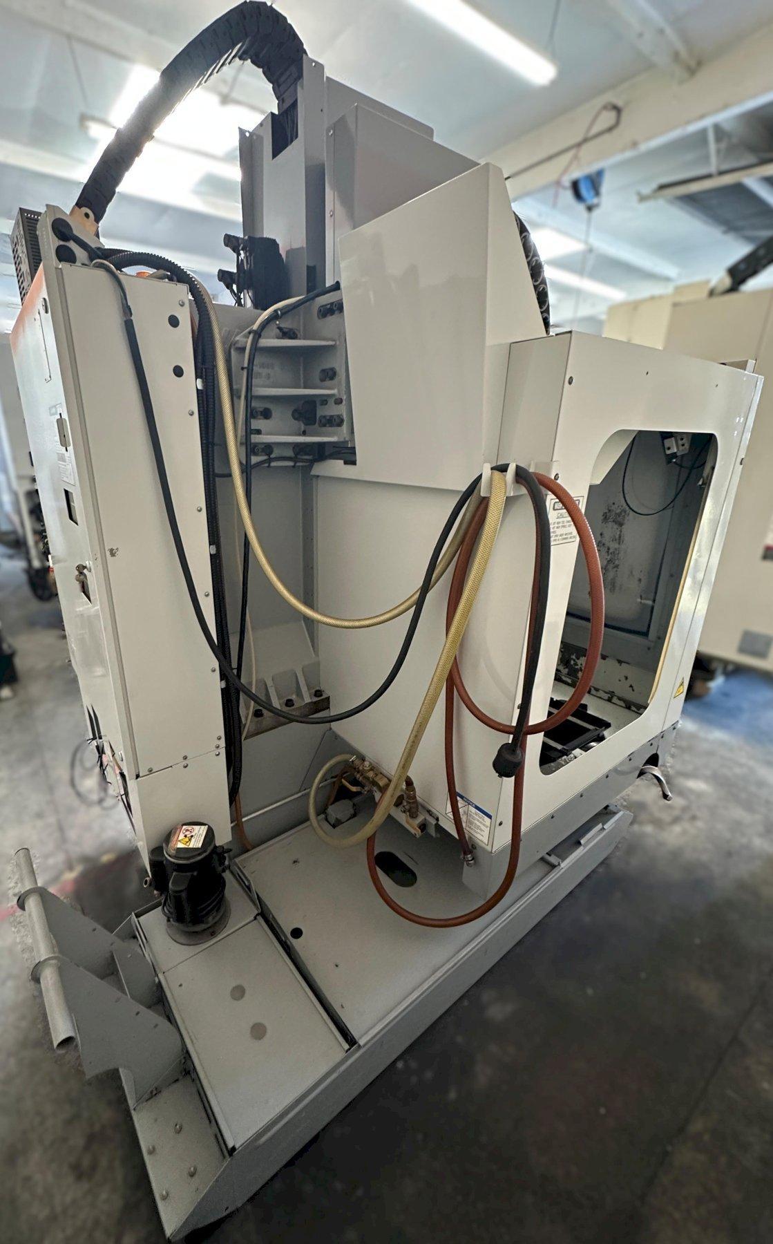 Haas VF-2D Vertical Machining Center 2007 With Rigid Tap, Remote Hand Jog, P-Cool, 4th Axis & 5th Axis Drives, 10,000 RPM Spindle, Chip Auger