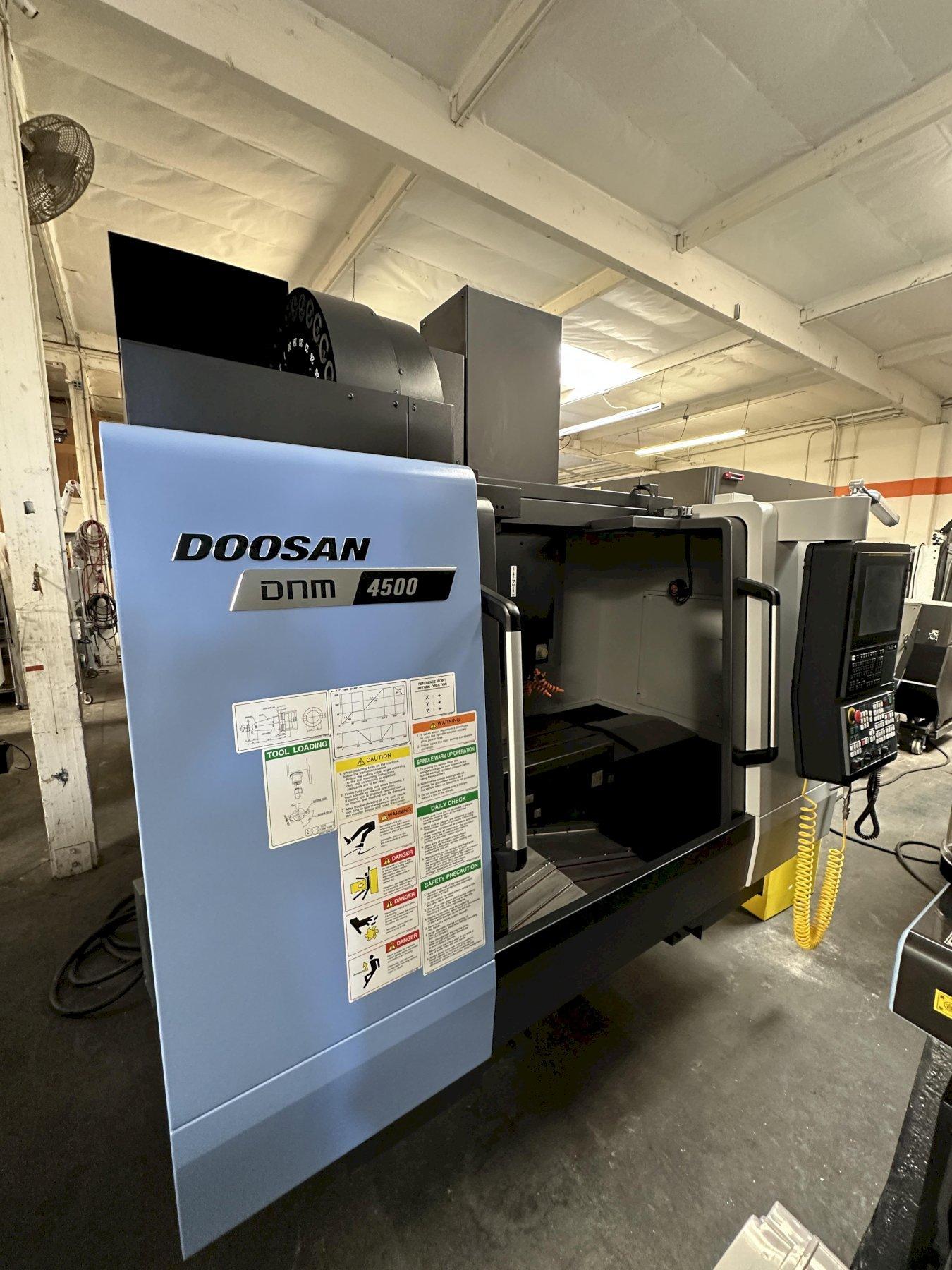 Doosan DNM4500 VMC Delivered New 2022 Fanuc i Series Plus Control 30 ATC CT40 Big Plus Spindle 12,000 RPM Renishaw Probe Ready Through Spindle Coolant Chip Conveyor
