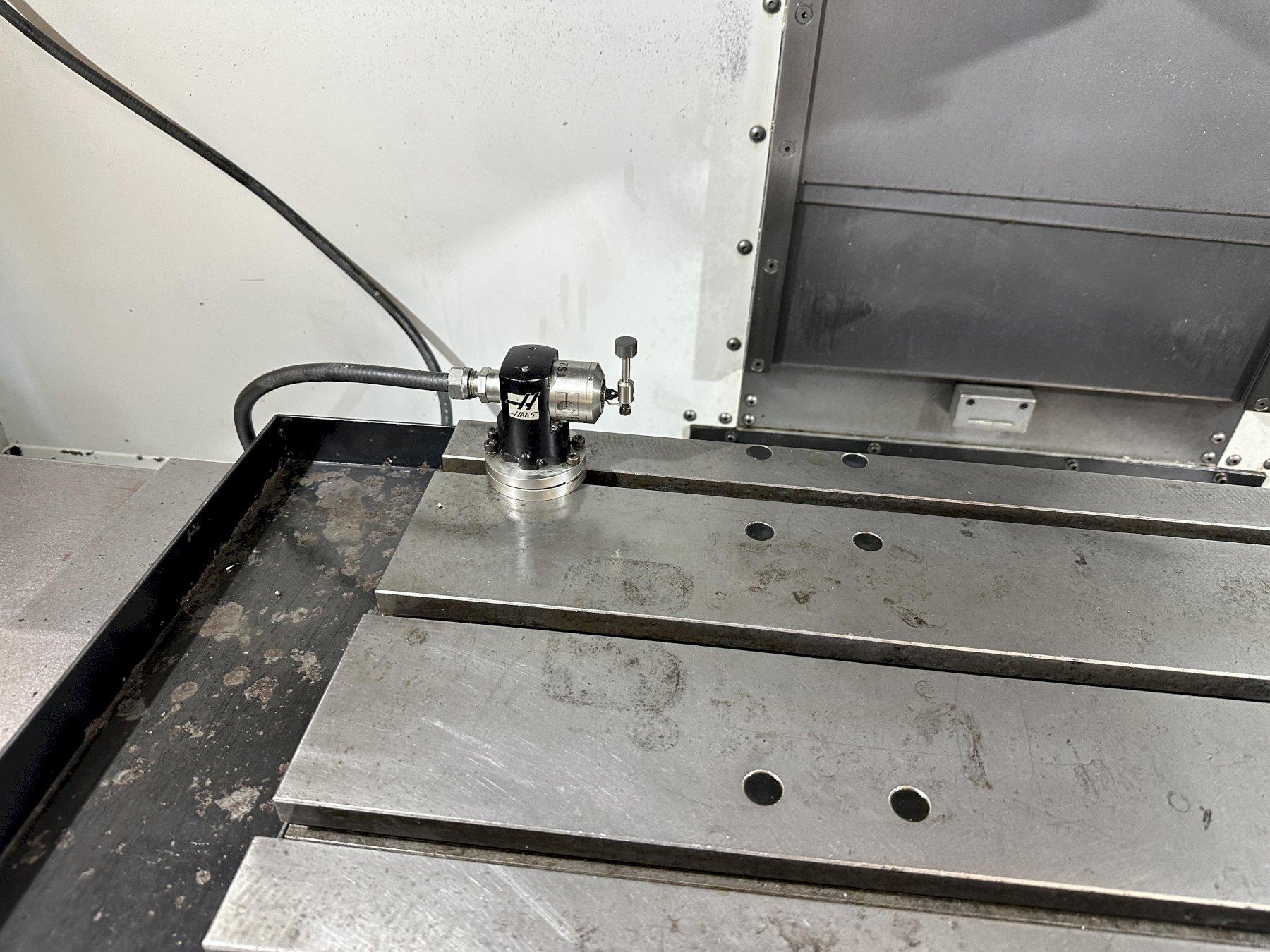 Haas VF-2D Vertical Machining Center 2007 With Rigid Tap, Remote Hand Jog, P-Cool, 4th Axis & 5th Axis Drives, 10,000 RPM Spindle, Chip Auger