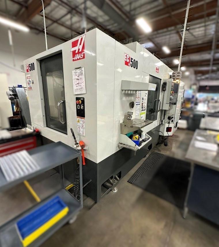 Haas EC-500 Horizontal Machining Center 2014 equipped with Haas CNC Control, CT40 Spindle, 70 Station Automatic Tool Changer, 4th Axis, Probing, Tomb Stones, TSC, Remote Hand Jog, Chip Conveyor, Coola