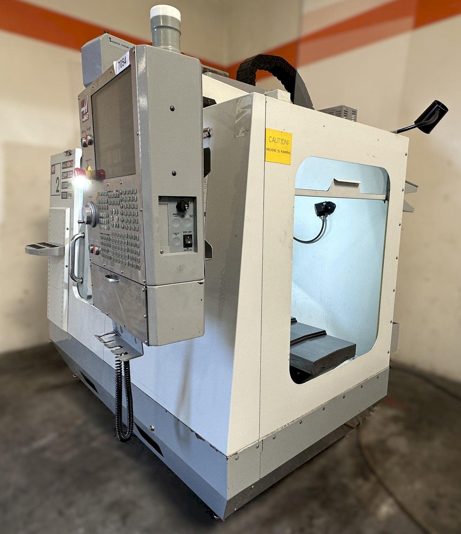 Haas VF-2D Vertical Machining Center 2007 With Rigid Tap, Remote Hand Jog, P-Cool, 4th Axis & 5th Axis Drives, 10,000 RPM Spindle, Chip Auger