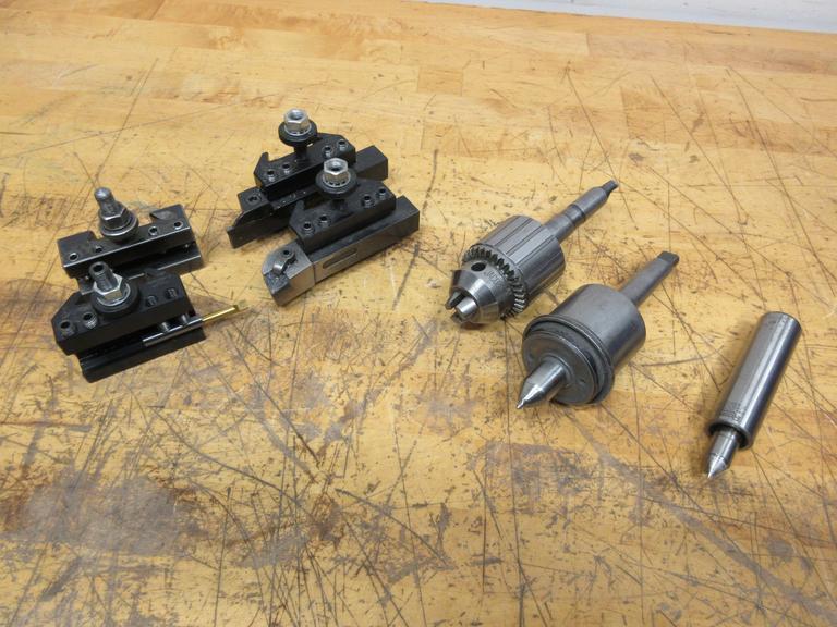 Manual Lathe Tooling, (3) Dorian QITP25-N and (1) Aloris AXA 1 Tool Post Holders, Jacobs Keyed Chuck & Live Center with #2 MT, Royal Live Center 1" Straight Shank- Auction Item