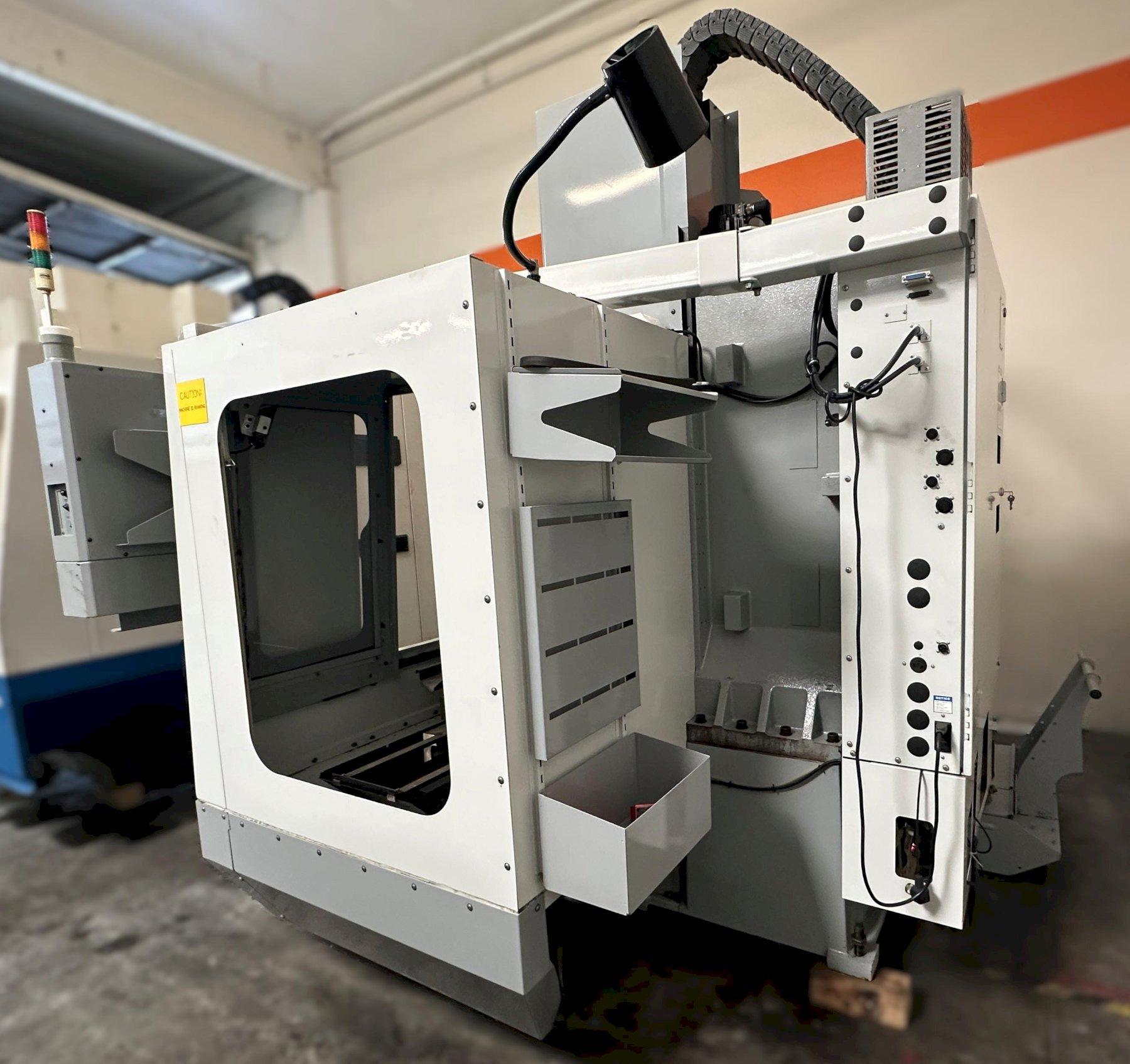 Haas VF-2D Vertical Machining Center 2007 With Rigid Tap, Remote Hand Jog, P-Cool, 4th Axis & 5th Axis Drives, 10,000 RPM Spindle, Chip Auger