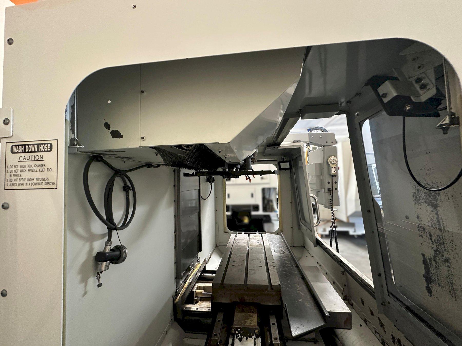 Haas VF-2D Vertical Machining Center 2007 With Rigid Tap, Remote Hand Jog, P-Cool, 4th Axis & 5th Axis Drives, 10,000 RPM Spindle, Chip Auger