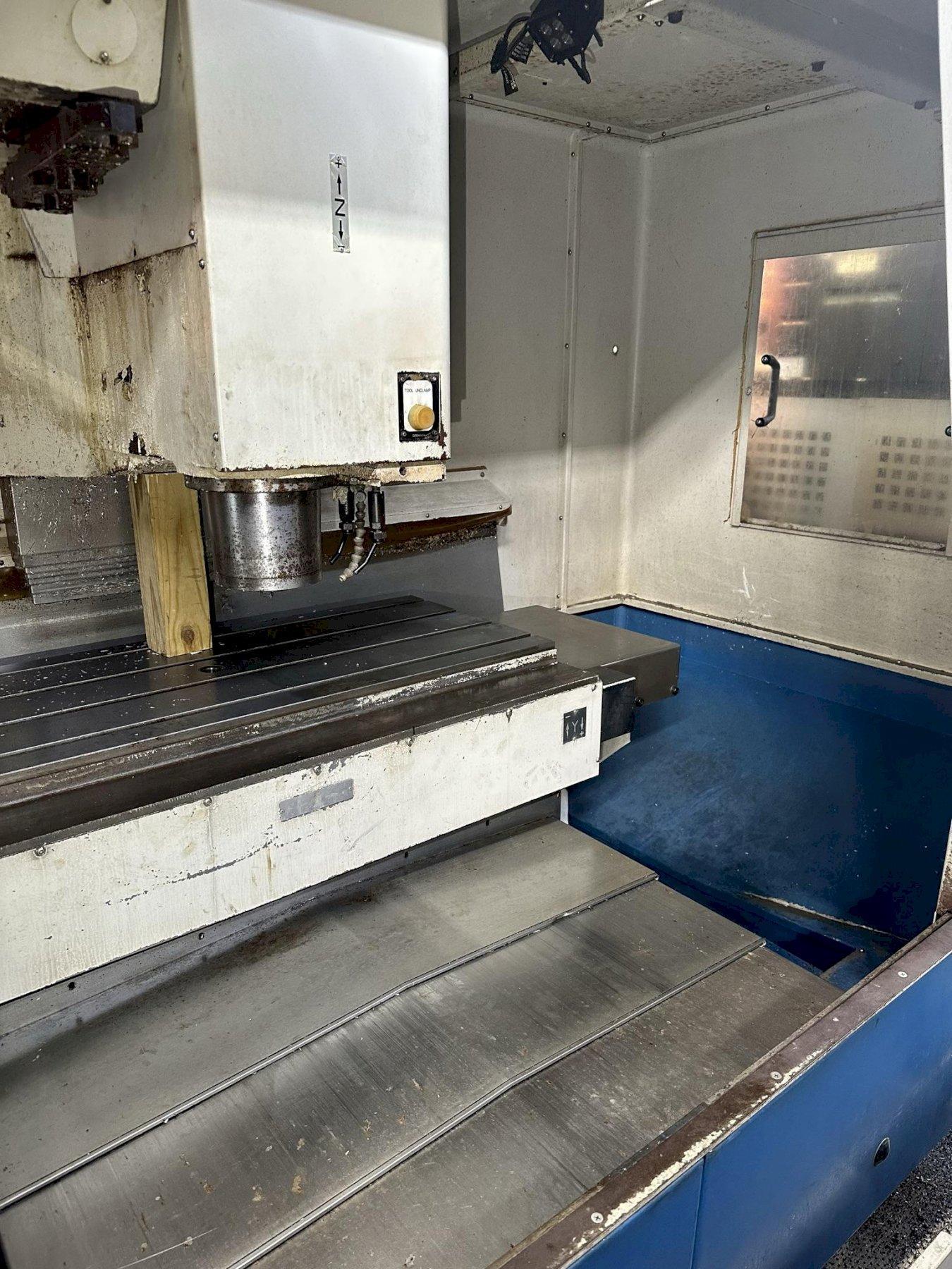 DAEWOO DMV-4020S CNC VERTICAL MACHINING CENTER, Fanuc 18iM CNC Control, 47" x 20" Table, X=40", Y=20", Z=20", CAT 40 Taper, 10,000 Max Spindle RPM, 30 ATC, Coolant System & Chip Pan, New 2002.