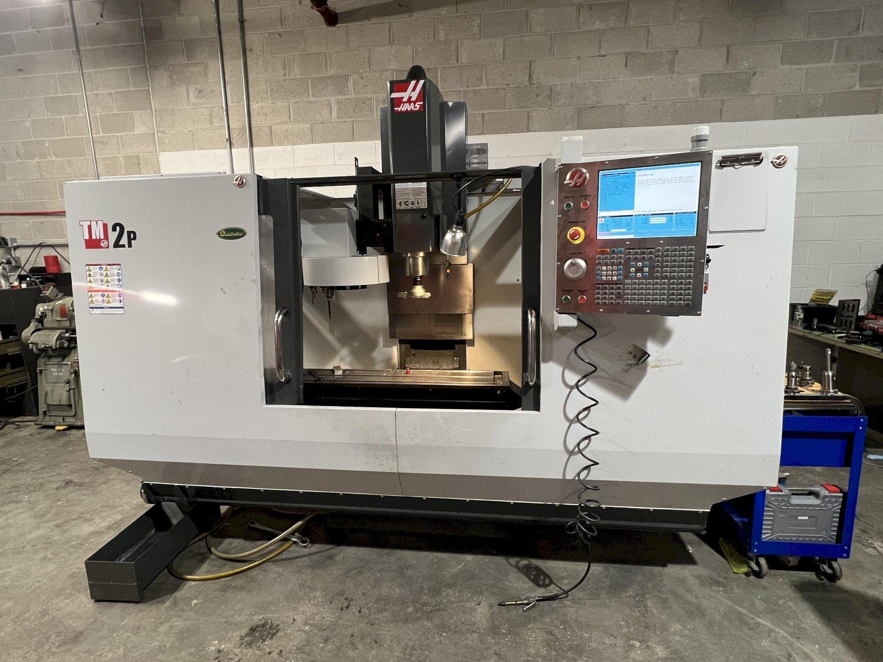 HAAS VERTICAL MACHINING CENTER, MODEL TM-2P, 57.75" x 10.5" TABLE, CT 40, 6000 RPM, 2013
