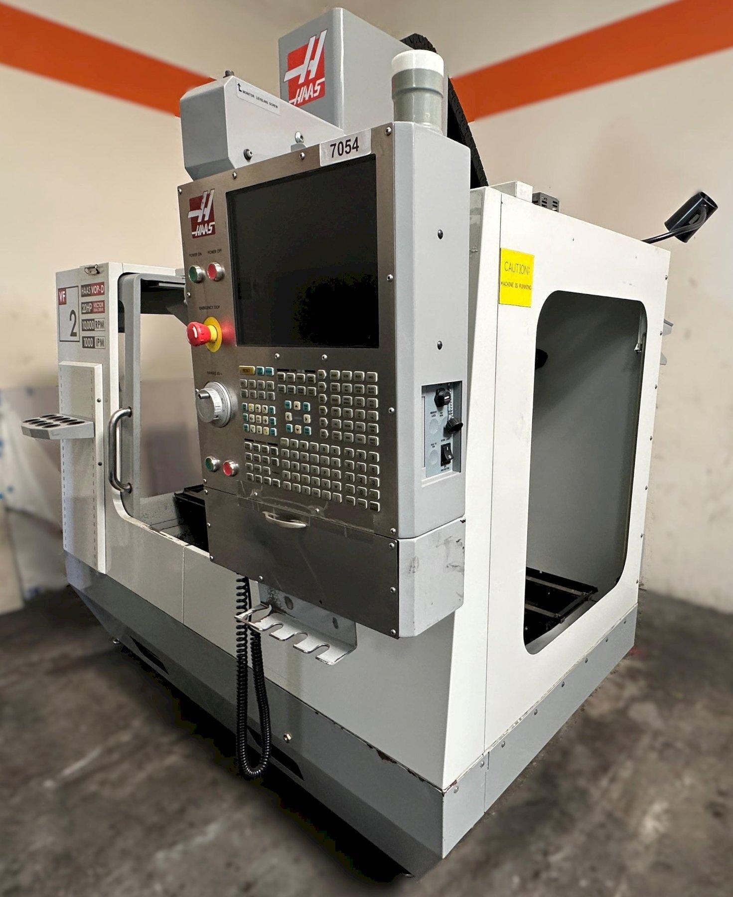 Haas VF-2D Vertical Machining Center 2007 With Rigid Tap, Remote Hand Jog, P-Cool, 4th Axis & 5th Axis Drives, 10,000 RPM Spindle, Chip Auger