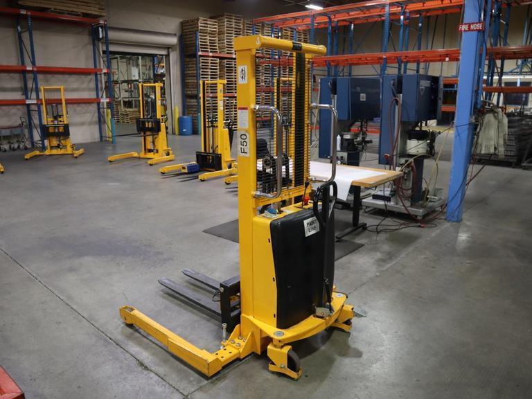 Uline H-2651 Electric Straddle Stacker Lift, 2,200# Cap, 63" Max Height, 50" Between Outriggers, 12 Volt Battery with Charger, 42" Forks- Auction Item