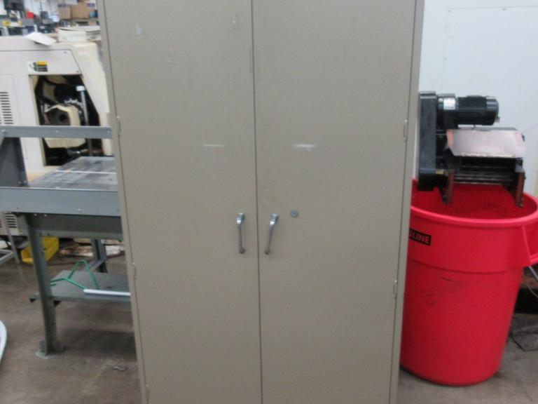 2 Door Metal Storage Cabinet with 6 Adjustable Shelves, with Contents of Lathe Jaws- Auction Item