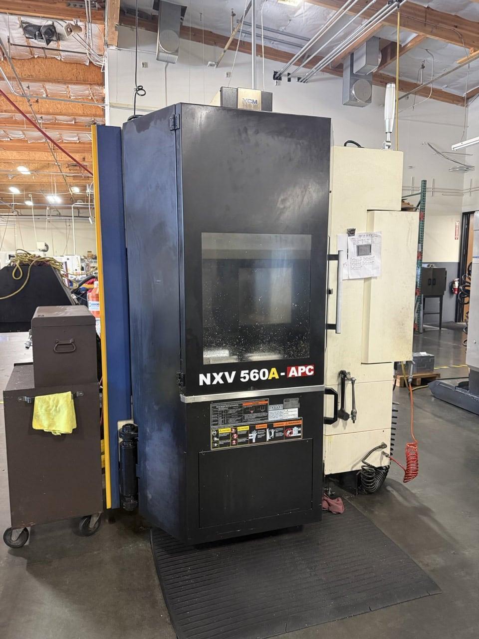YCM NXV560A-APC VMC, 2015 – Chip Conveyor, Fanuc Control, 12K RPM