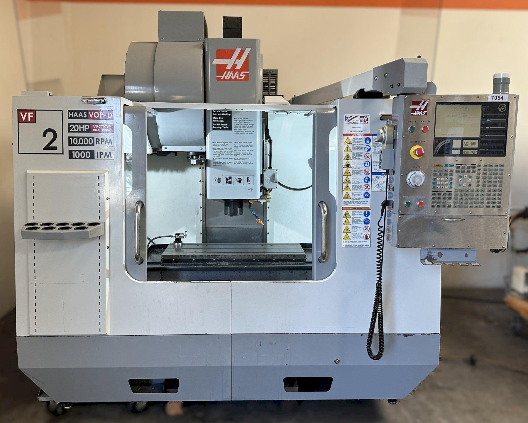 Haas VF-2D Vertical Machining Center 2007 With Rigid Tap, Remote Hand Jog, P-Cool, 4th Axis & 5th Axis Drives, 10,000 RPM Spindle, Chip Auger
