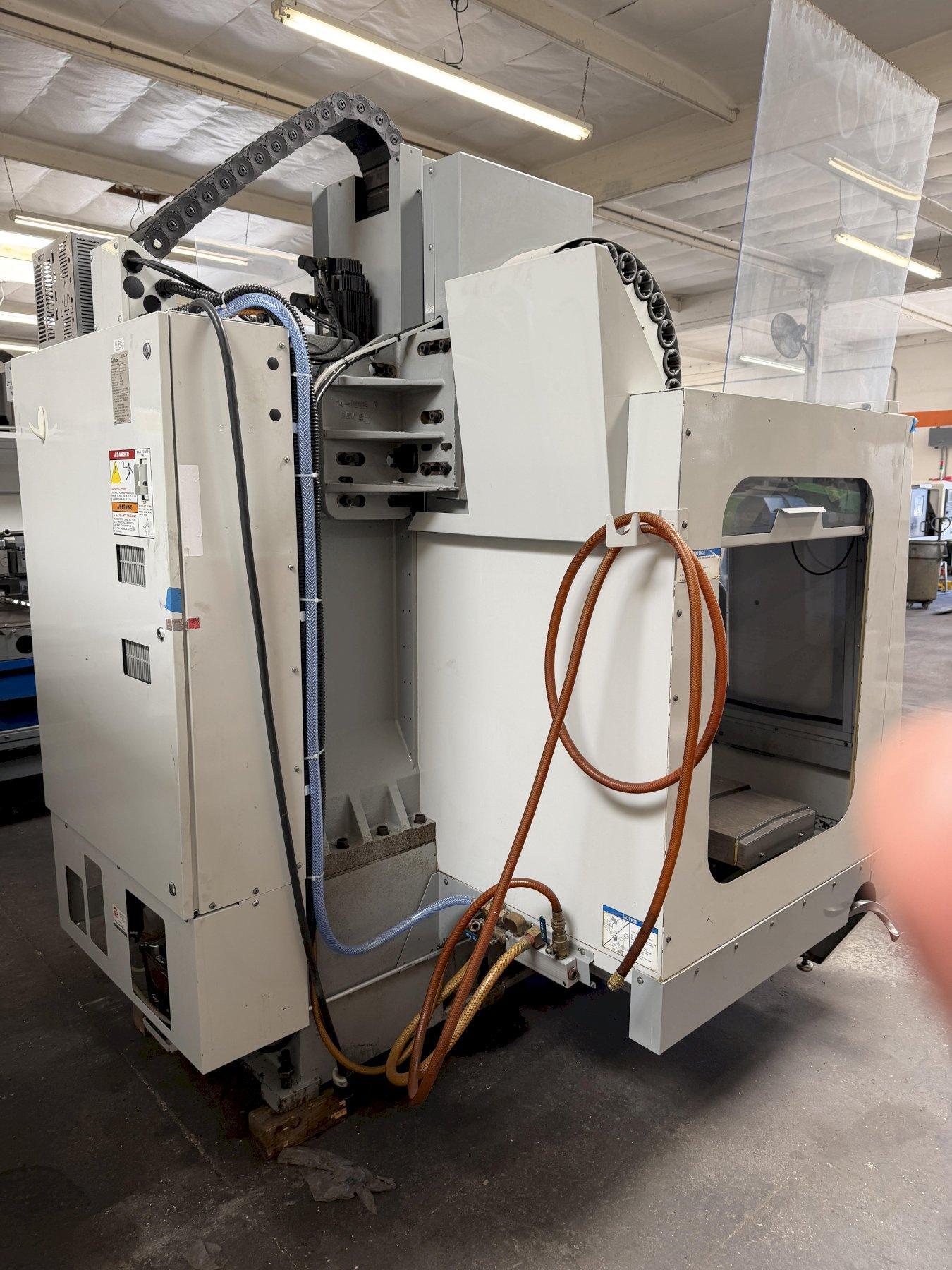 Haas VF-2B Vertical Machining Center 2007 With 2 Speed Gear Box, Rigid Tap, Remote Hand Jog, P-Cool, Hil, 4th Axis Ready, 10,000 RPM Spindle, Chip Auger