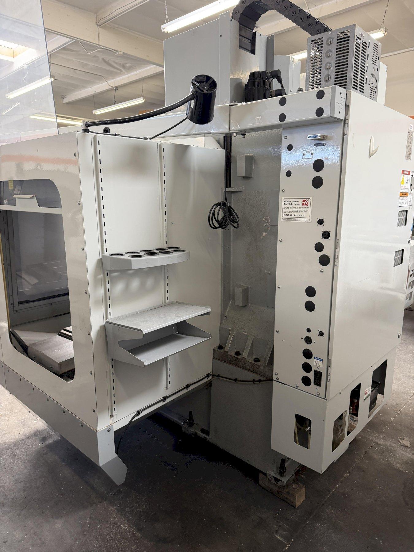 Haas VF-2B Vertical Machining Center 2007 With 2 Speed Gear Box, Rigid Tap, Remote Hand Jog, P-Cool, Hil, 4th Axis Ready, 10,000 RPM Spindle, Chip Auger