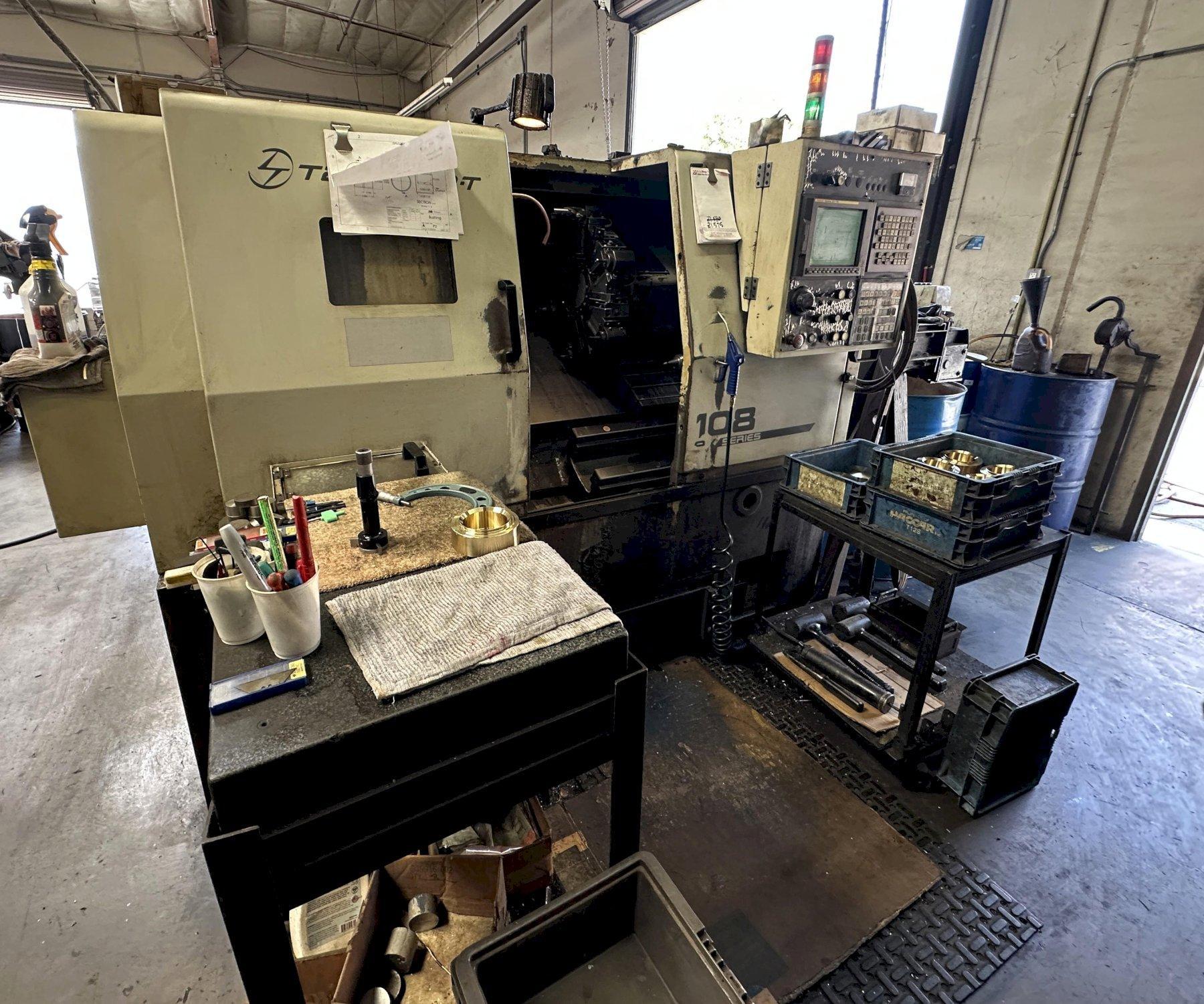 Takisawa-T EX-108 Series CNC Lathe equipped with 3-Jaw Chuck, Coolant Tank and Chip Conveyor