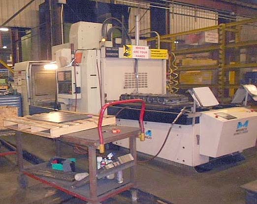 MONARCH VMC-50 CNC VERTICAL MACHINING CENTER, Fanuc 18iMB CNC Control, 56" x 27" Table, X=51", Y=25.6", Z=27", 50 Taper, 4000 RPM, Midaco `add-on' Pallet Shuttle, New 2007.