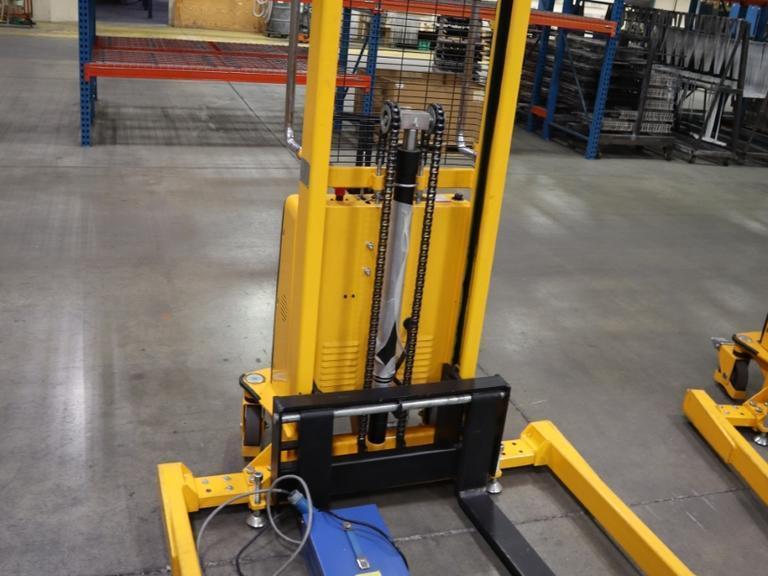Uline H-5439 Electric Straddle Stacker Lift, 2,200# Cap, 63" Max Height, 50" Between Outriggers, 12 Volt Battery with Charger, 42" Forks- Auction Item