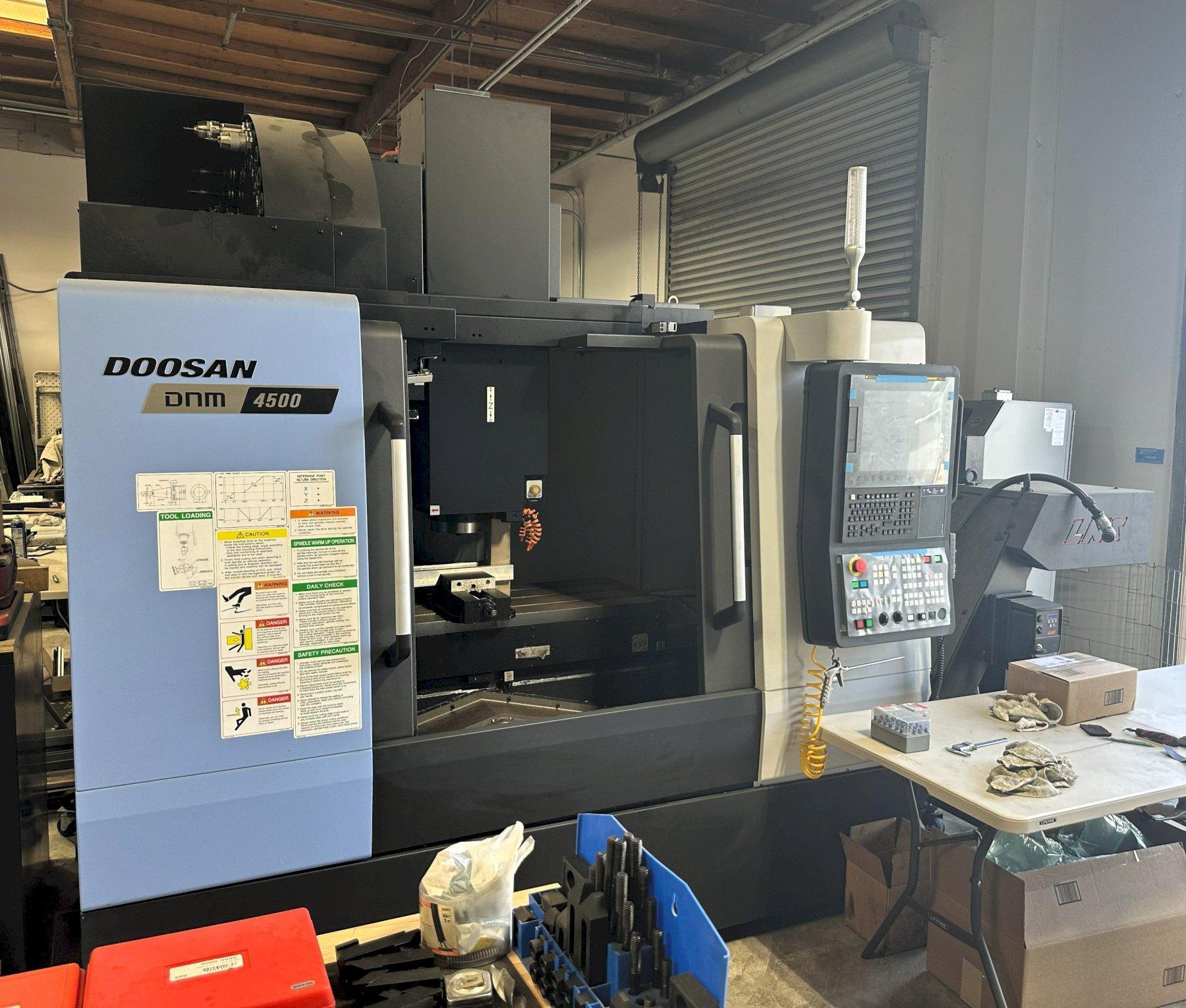 Doosan DNM4500 VMC 2002 Fanuc i Series Plus Control 30 ATC CT40 Big Plus Spindle 12,000 RPM Renishaw Probe System