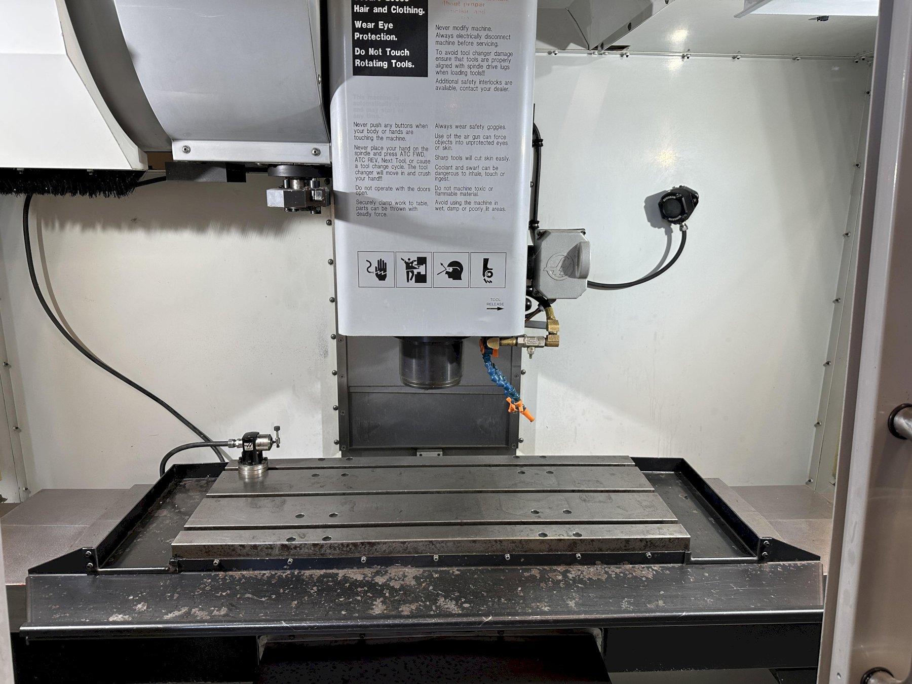 Haas VF-2D Vertical Machining Center 2007 With Rigid Tap, Remote Hand Jog, P-Cool, 4th Axis & 5th Axis Drives, 10,000 RPM Spindle, Chip Auger