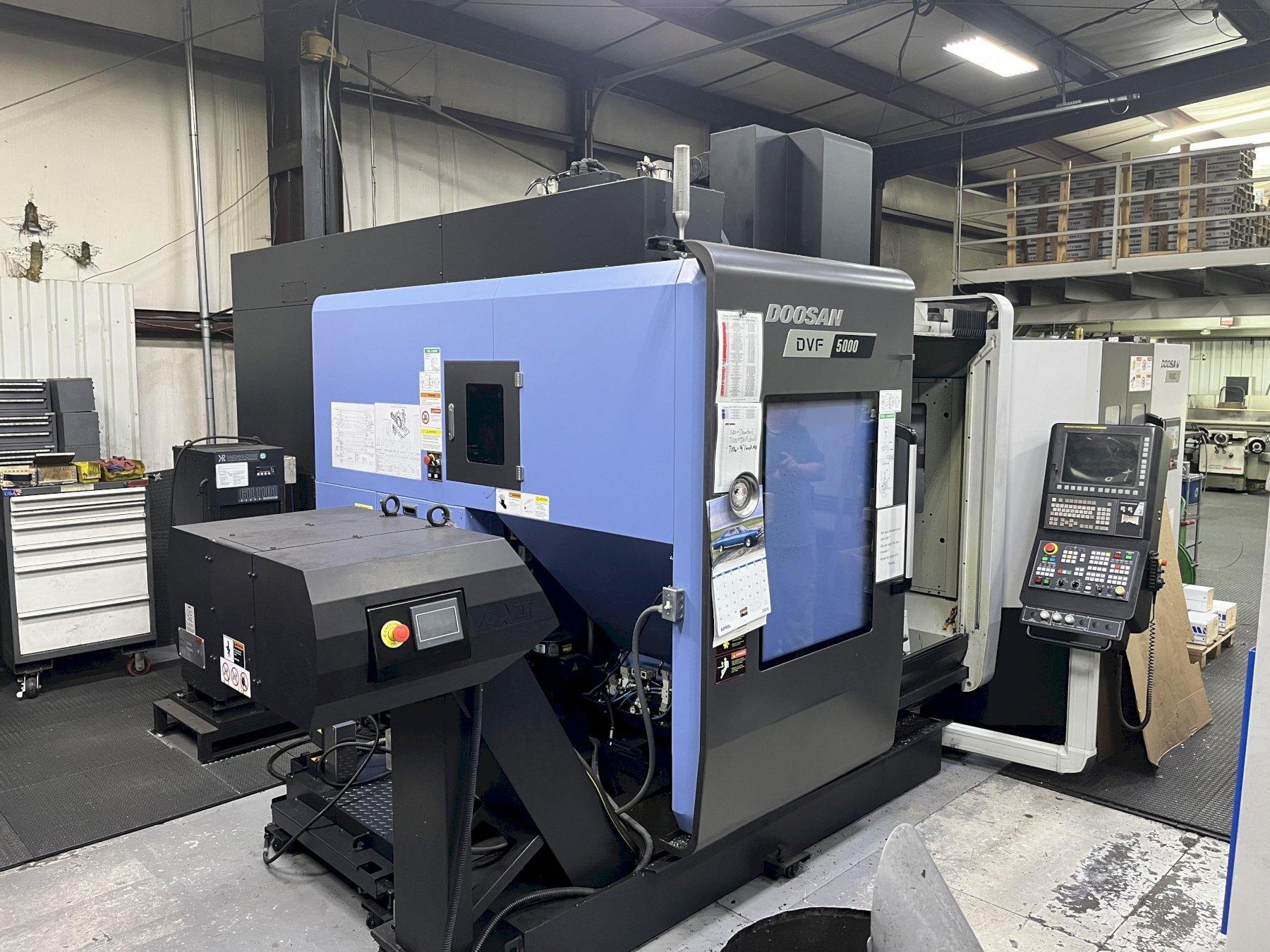 Doosan DVF5000 2019 AWC 6 Pallet Changer Fanuc 31i- MODEL B5 Control 120 Tool ATC Tool Setter Probing Package Filtration Conveyor
