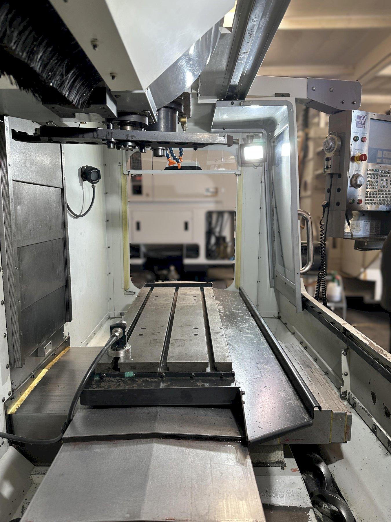 Haas VF-2D Vertical Machining Center 2007 With Rigid Tap, Remote Hand Jog, P-Cool, 4th Axis & 5th Axis Drives, 10,000 RPM Spindle, Chip Auger