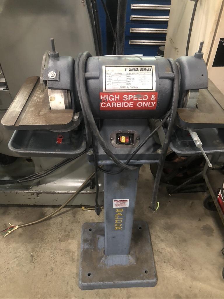 BALDOR DOUBLE END CARBIDE GRINDER WITH TWO 6" WHEELS AND SWIVEL TABLE