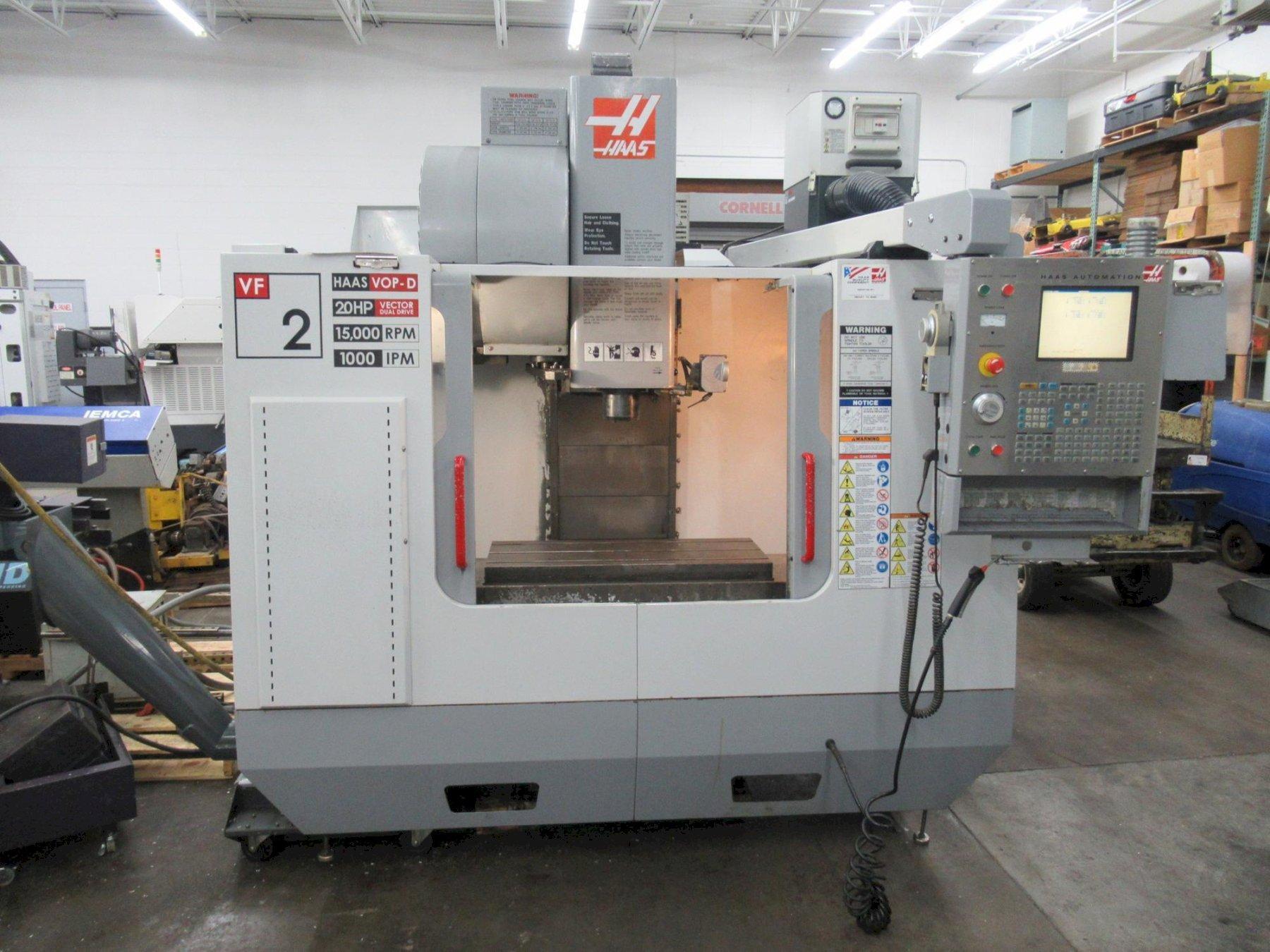 Haas VF-2 CNC Vertical Machining Center with 15,000 RPM CT-40 Spindle, High Speed Machining, Side Mount Tool Changer, 4th Axis Ready, Macros, and Chip Auger.