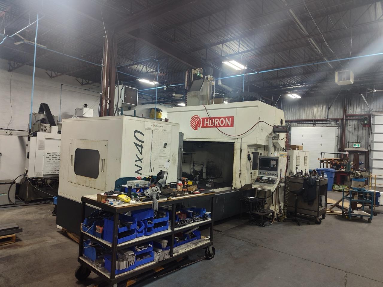 Huron NX40 Double Column Bridge Gantry Machining Center, 2013 – J30 High Pressure Through Spindle Coolant System, Chip Conveyor, Tooling, Siemens Sinumerik Control