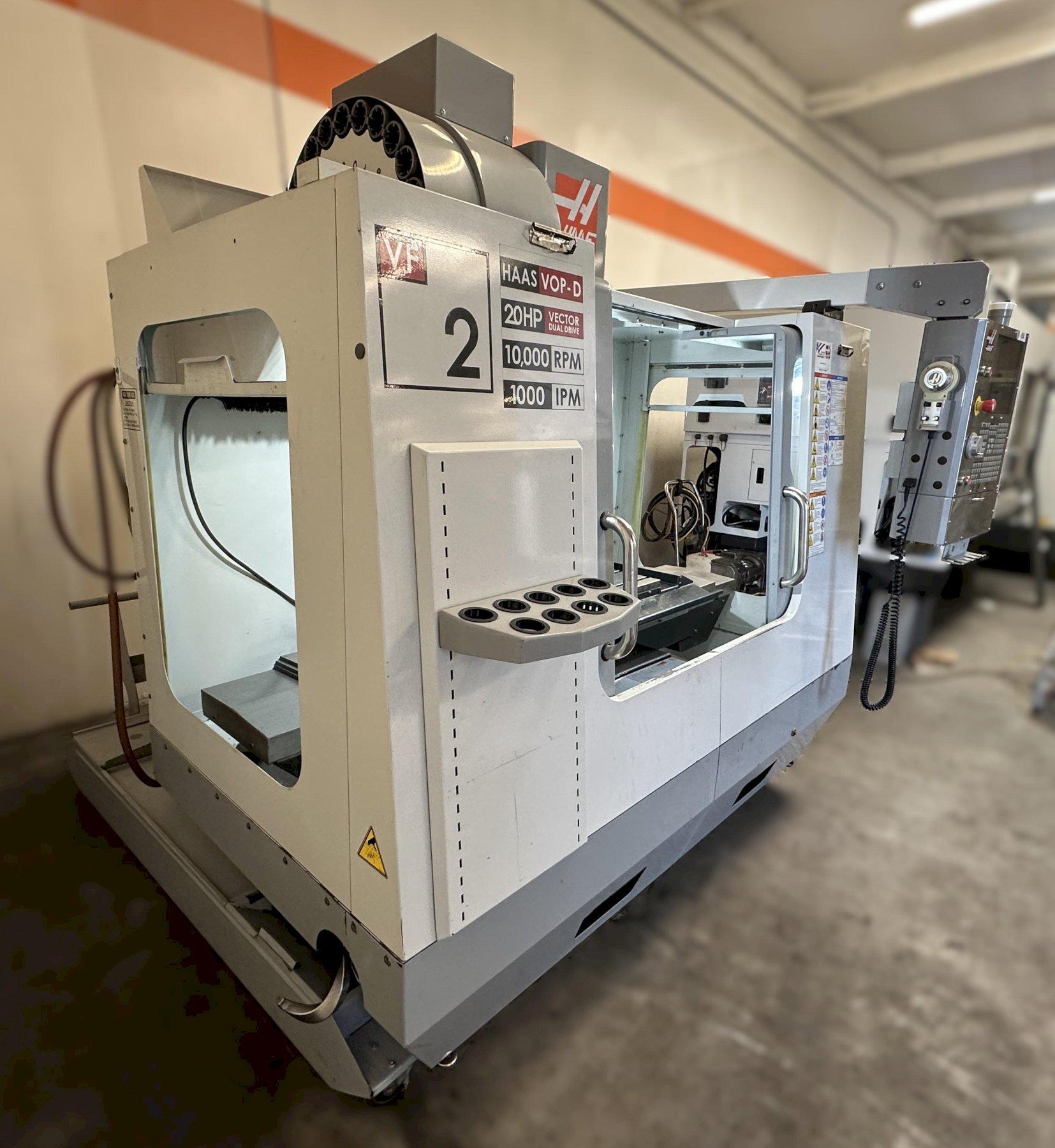 Haas VF-2D Vertical Machining Center 2007 With Rigid Tap, Remote Hand Jog, P-Cool, 4th Axis & 5th Axis Drives, 10,000 RPM Spindle, Chip Auger
