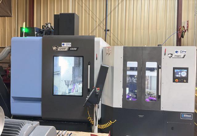 Doosan DVF 5000 5-Axis VMC, 2022 – 18K Spindle, 120 ATC, Through Spindle Coolant/Air, 8 Pallet Changer, Probing, Mist Collector, Conveyor