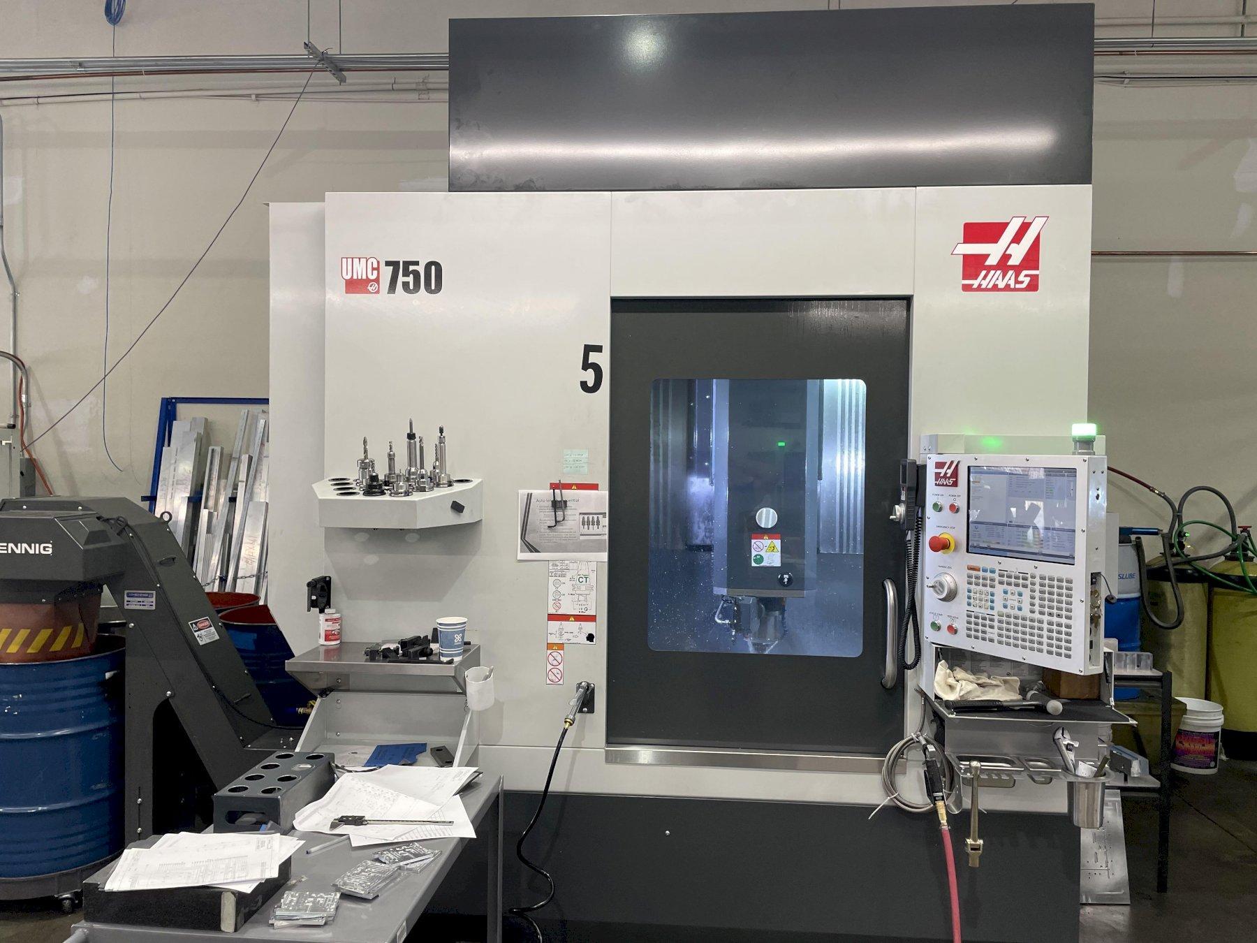 Haas UMC-750 5-Axis 2021 with: 5th Axis, 10k RPM Spindle, Through Spindle Coolant, 30-SMTC, HSM, Probing, Chip Conveyor, and Coolant Tank.