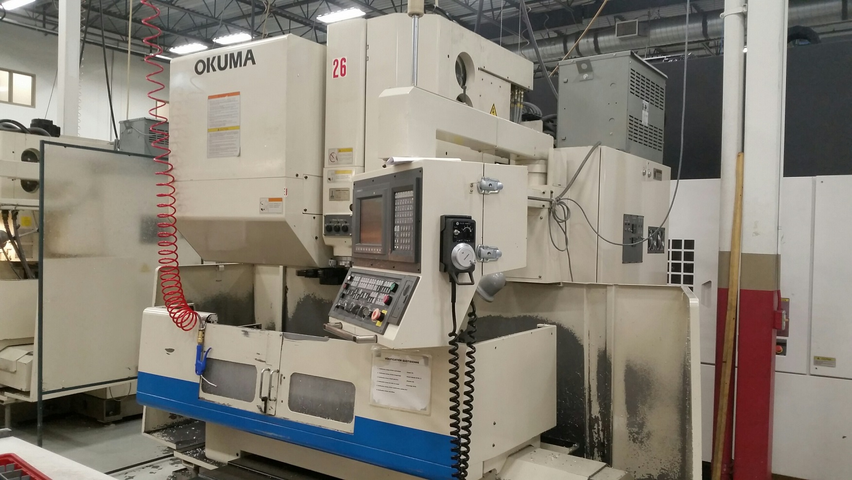 OKUMA MC-40VB CNC VERTICAL MACHINING CENTER WITH 50 TAPER SPINDLE AND 4TH AXIS DRIVE