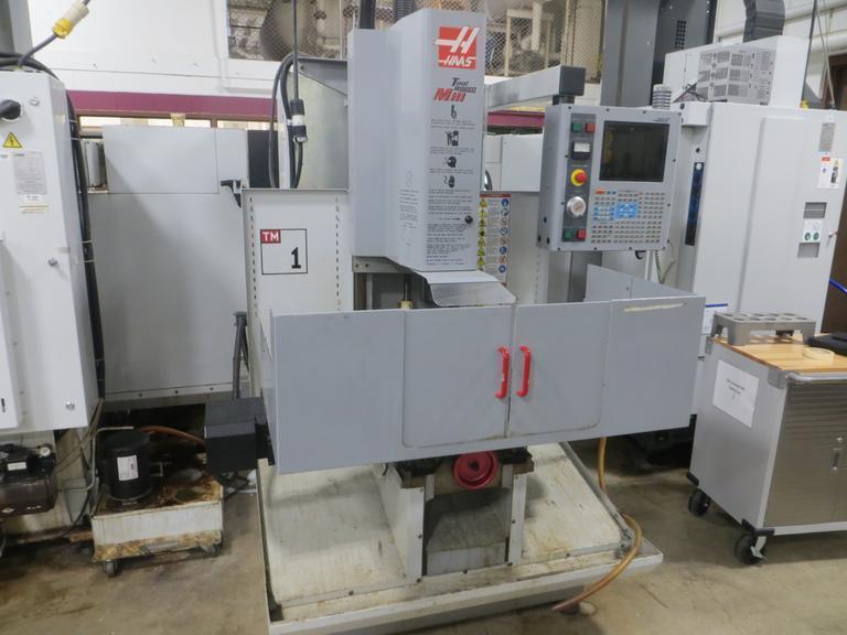 Haas TM-1 CNC Tool Room Mill, Haas 32-Bit CNC Control, 40 Taper, Splash Guards, Coolant Tank & Pump- Auction Item