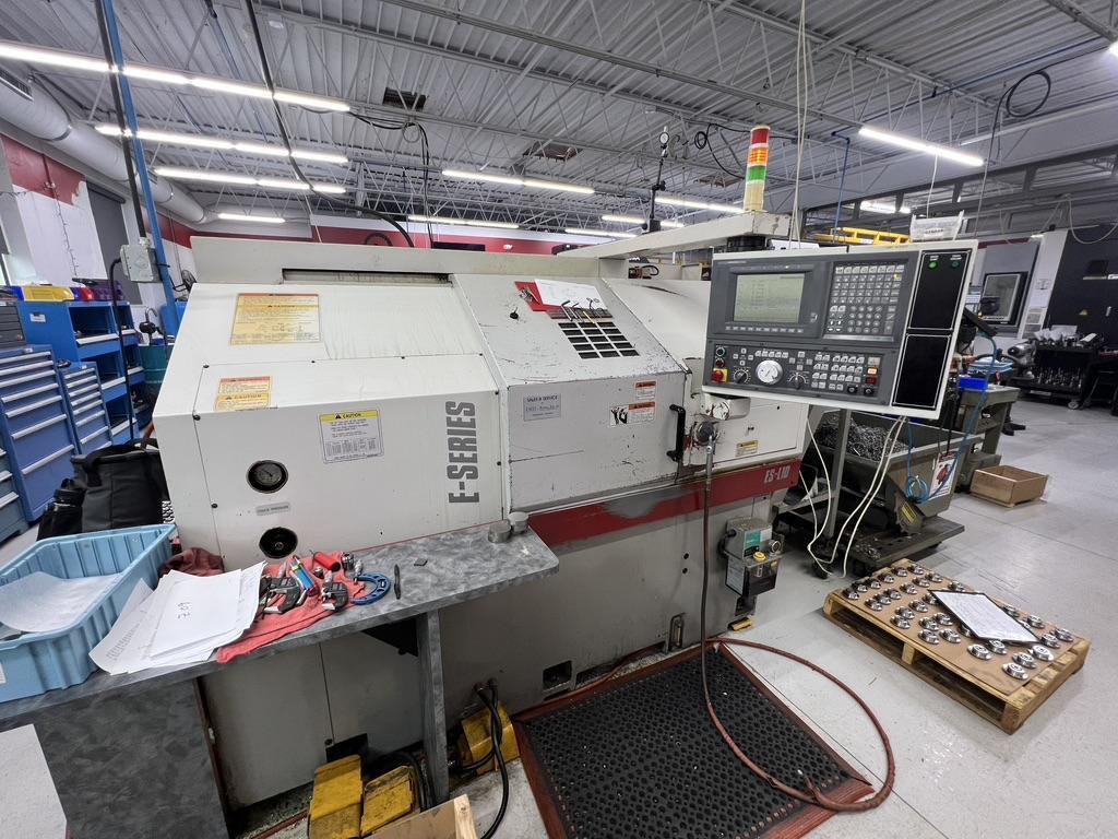 OKUMA ES-L10 CNC LATHE WITH 12 STATION TURRET, 10" 3 JAW CHUCK, OSP-U10L CNC CONTROL WITH IGF PROGRAMMING, TAILSTOCK, CHIP CONVEYOR