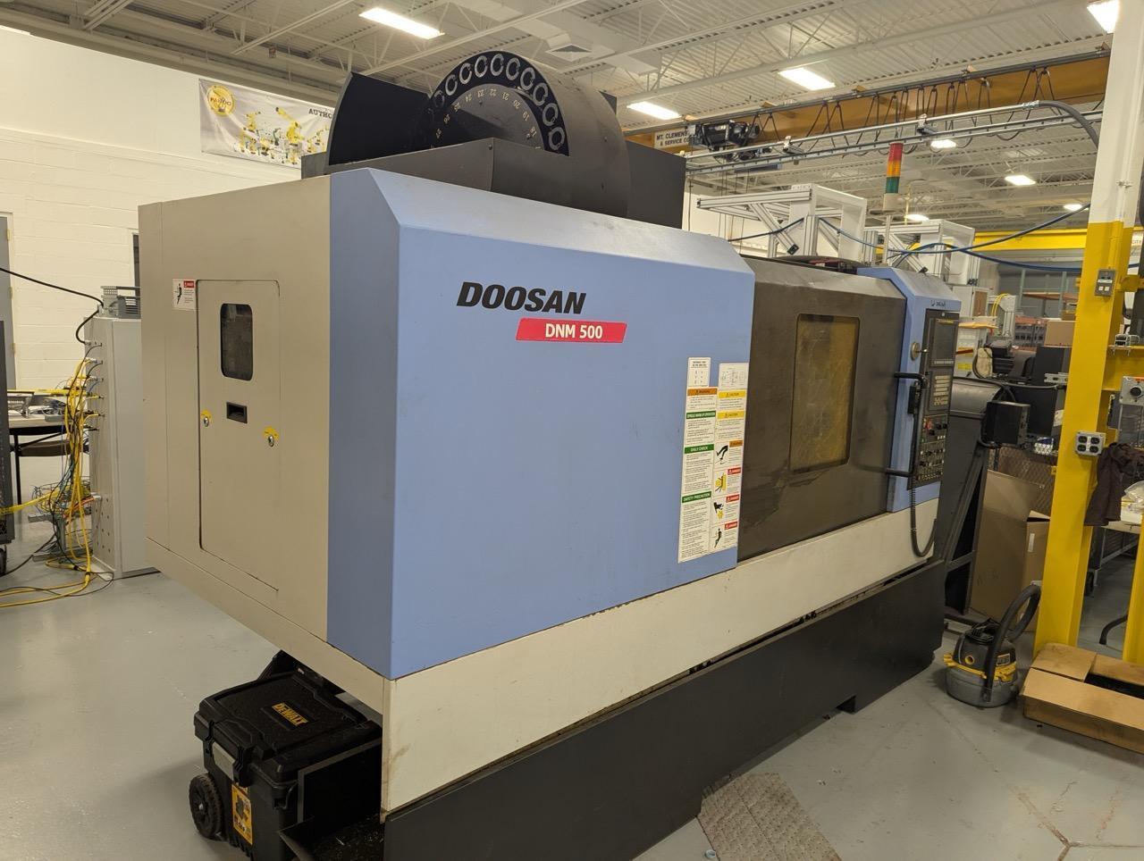 Doosan DNM500 VMC, 2008 – Chip Conveyor