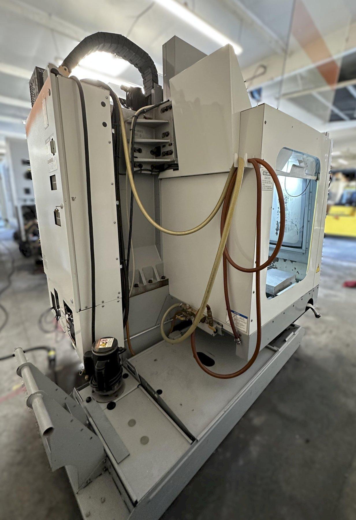 Haas VF-2D Vertical Machining Center 2007 With Rigid Tap, Remote Hand Jog, P-Cool, 4th Axis & 5th Axis Drives, 10,000 RPM Spindle, Chip Auger