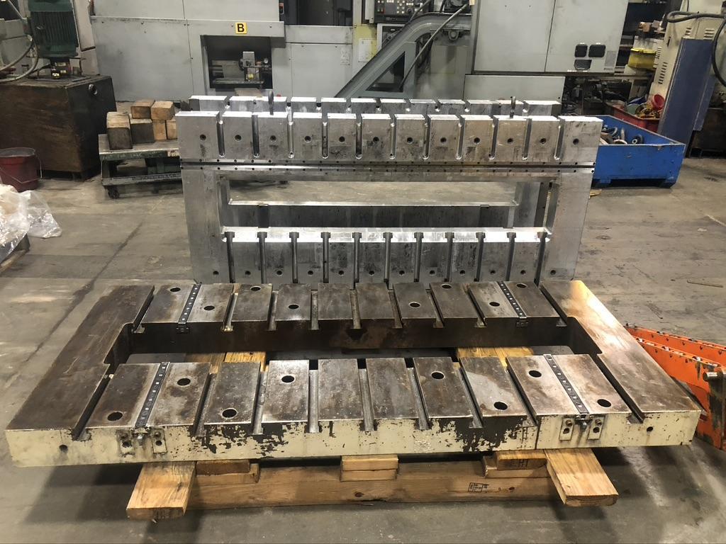 33.5" x 75"  T-Slotted Minster quick change bolster plate with two Aluminum roll on bolsters, 10" x 63" cutout, 5" thick, 11 t-slots