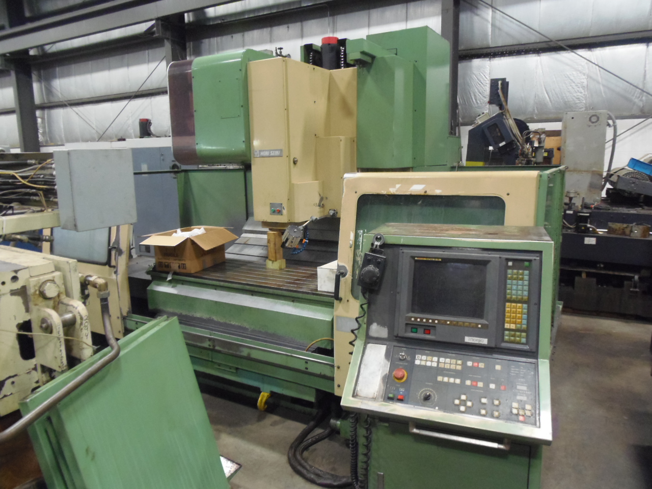 MORI SEIKI MV-65, VERTICAL MACHINING CENTER, 25.5" x 67" TABLE, 30 ATC, 50 TAPER, FANUC 15-M, 1990, THRU SPINDLE COOLANT, WIRED FOR 4TH AXIS.