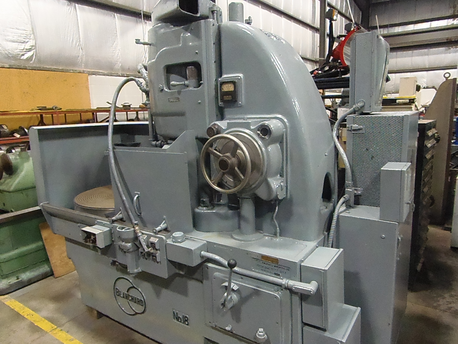 36 IN. BLANCHARD GRINDER 18-36, 40 HP, 18 IN. SEGMENTED WHEEL, 38 IN. MAX. SWING, 12 IN. MAX. DISTANCE UNDER WHEEL, 1950
