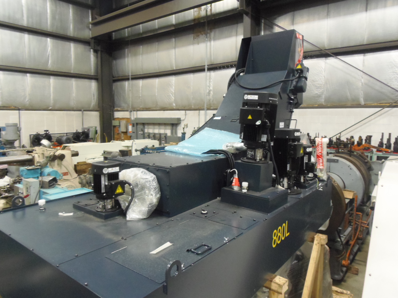 UNUSED HI PRESSURE COOLANT/CONVEYOR SYSTEM FROM MAKINO A61 HORIZONTAL MACHINING CENTER