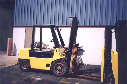 6,600 LB. HYSTER MODEL H60XL, 90, 143" LIFT, SOLID TIRES