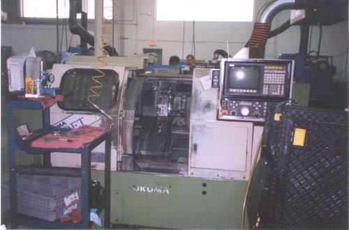 OKUMA CADET, 8" CHUCK, 15.75" SWING, WITH CHIP CONVEYOR, 1993