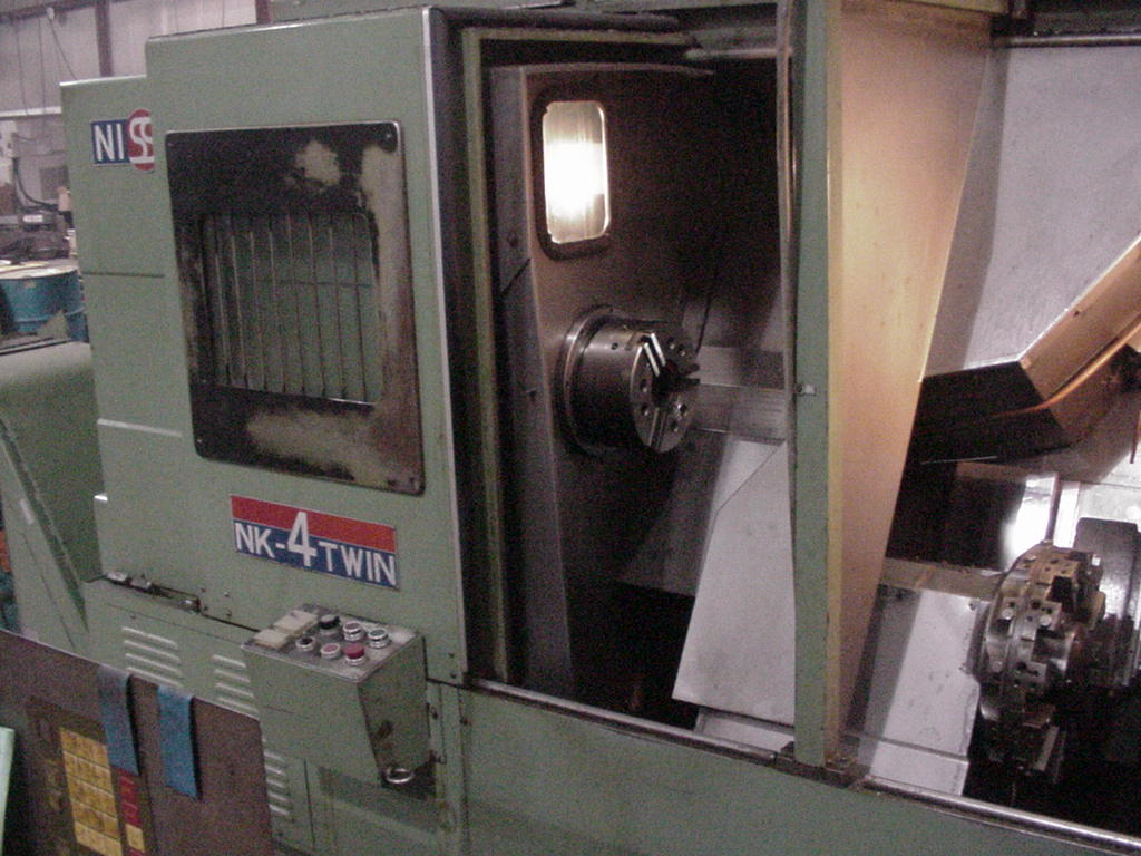 NISSIN NK-4 TWIN, 8" BED, 13" CROSS SLIDE, NISSIN FANUC 2-SPDL 4-AXIS CTRL, 12" 3-JAW CHK, 1987, MT 7 TAPER