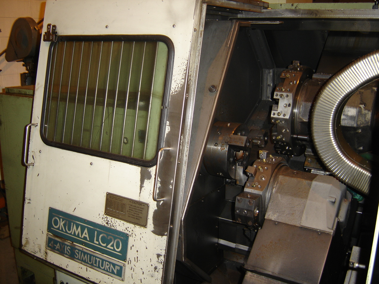 OKUMA LC20-2S, OSP500L CTRL,  15.75" SWOB, 2.05 BORE DIA., 3500 RPM, CHIP CONVEYOR, 4-AXIS
