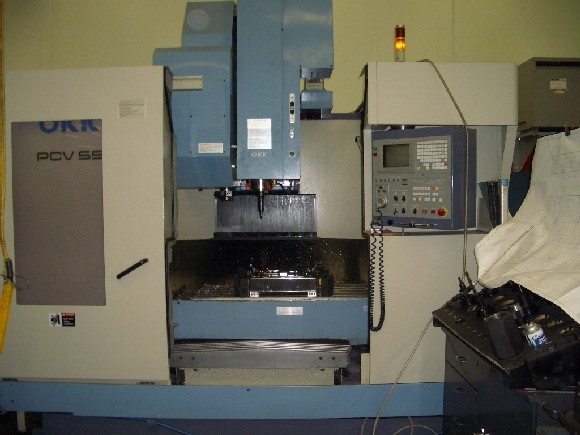 OKK PCV-55, 40"-X, 22"-Y, 47"-Z, 48" x 22" TBL, CAT 50, MELDUS M520MR CNC CTRL, 20 ATC