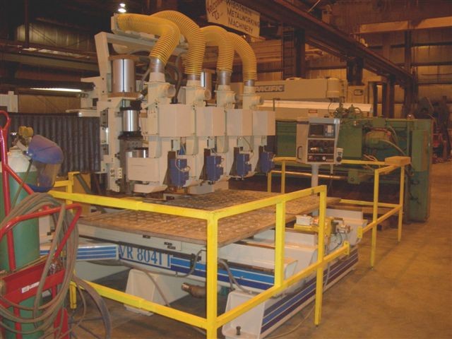 NO. VR804TT KOMO, 4-AXIS, 128" x 66.5" x 8" TRVLS, (2) 48" x 60" x 1.5" TBL, FANUC OM CTRL, 1994