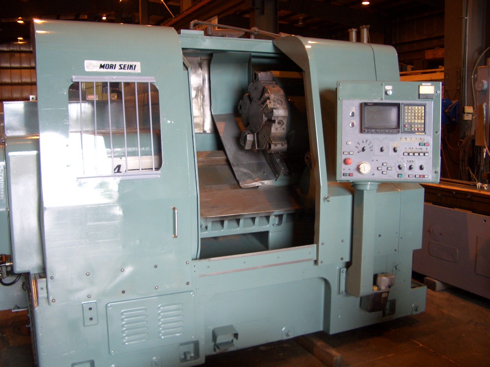MORI SEIKI SL-4A, 25.5" OB, 23.6" OCS, 30.1" CTRS, 16.5" STR, 3000 RPM, FANUC 10T CTRL, CHIP CONVEYOR, TAILSTOCK
