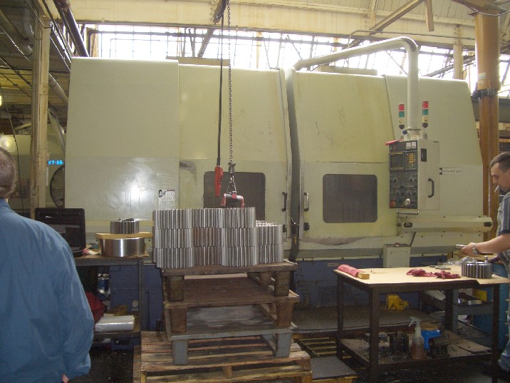 HWACHEON ECO 5V TWIN SPINDLE CNC VERTICAL LATHE, 1999, CAT 50, 25 HP, 12 TOOLS X 2, FANUC OT, CHIP CONVEYOR, COOLANT